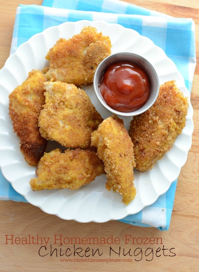 Ditch the frozen nuggets! Try one of these top healthy homemade chicken nugget recipes you can feel proud to serve your kids. freezer chicken nuggets on a plate with ketchup