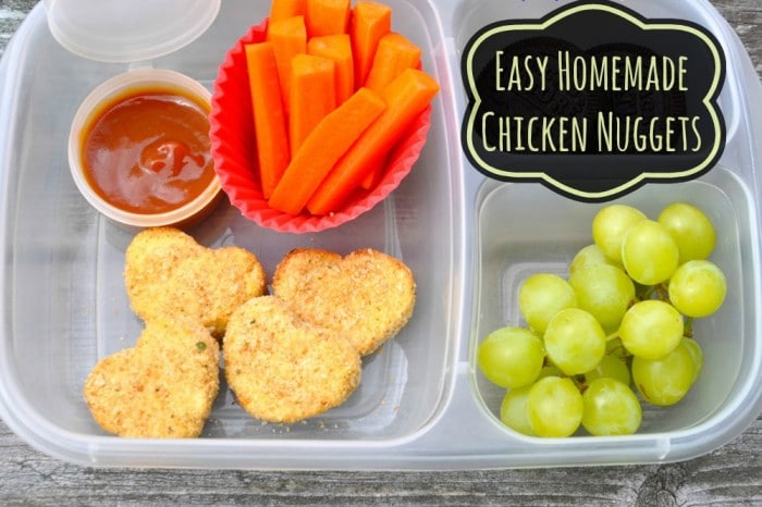 Ditch the frozen nuggets! Try one of these top healthy homemade chicken nugget recipes you can feel proud to serve your kids. chicken nuggets fruit and veggies in a lunchbox