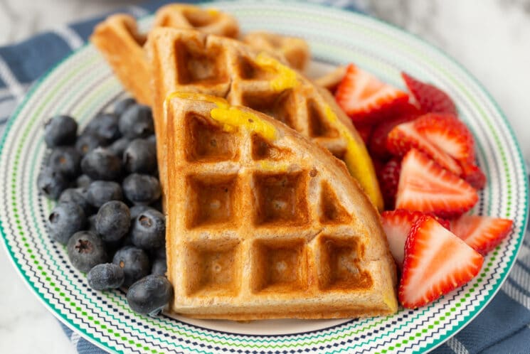 waffle with egg on top and berries