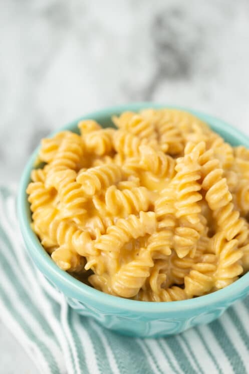 creamy homemade mac and cheese in a blue bowl