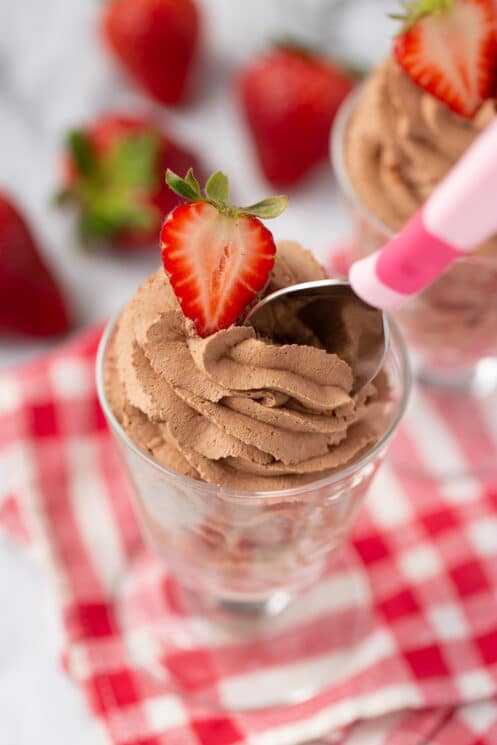 spoon digging into healthy chocolate mousse