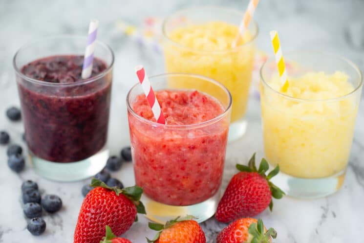 real fruit slushies in glasses with colorful straws