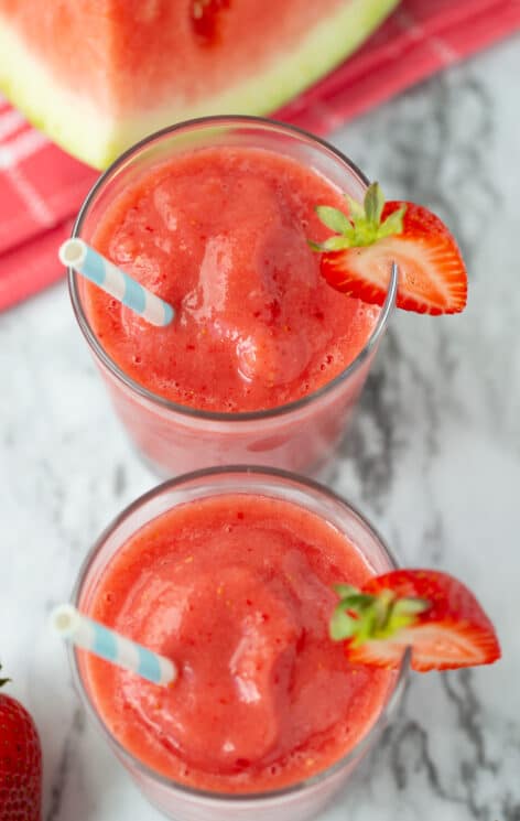 watermelon strawberry smoothie in glasses with straws