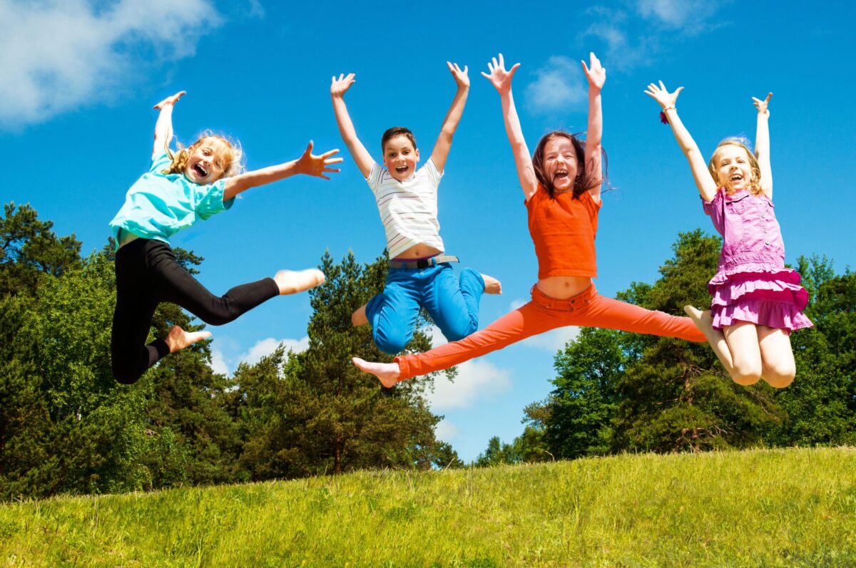 Healthy kids jumping in the air