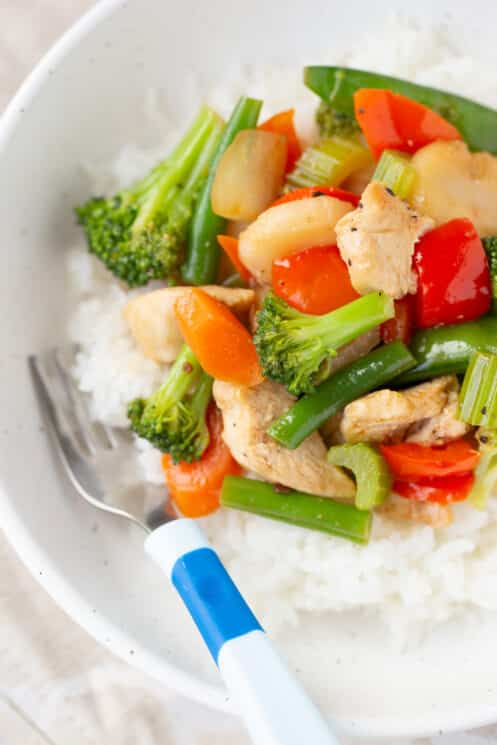 freezer meal stir fry warmed up in a bowl with rice