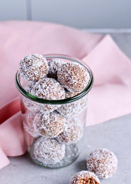 Puffed Quinoa Date energy balls in a mason jar. 