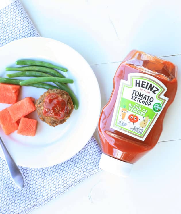 healthy dinner of meatload, green beans and watermelon on a plate