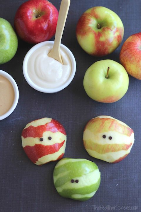 apples partially peeled to look like mummies