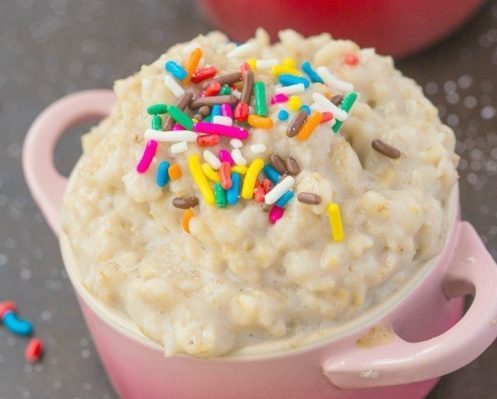 little pink dish of oatmeal with rainbow sprinkles