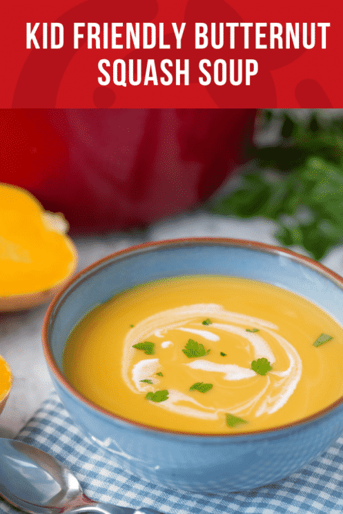 blue bowl of butternut squash soup with a swirl of cream on top