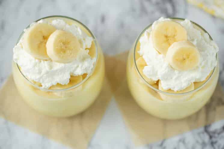 two cups of banana pudding with fresh whipped cream