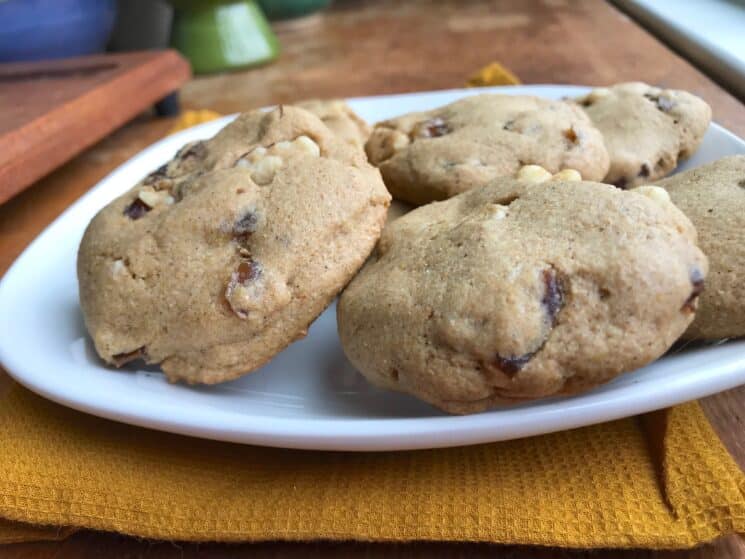 sideways view of hermit cookies stacked on a plate