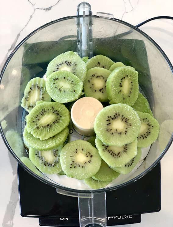 Kiwi Sorbet 3 Frozen kiwis in a food processor