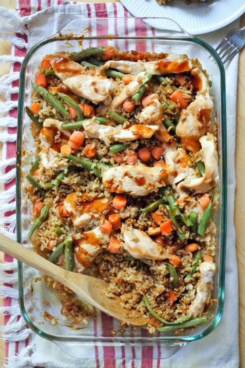 teriyaki chicken casserole in a glass baking dish on a white and red dish towel