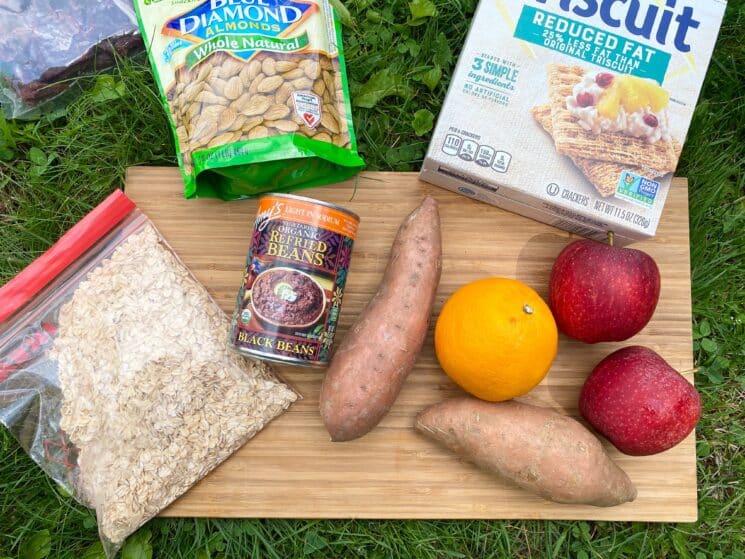 healthy camping foods on a cutting board