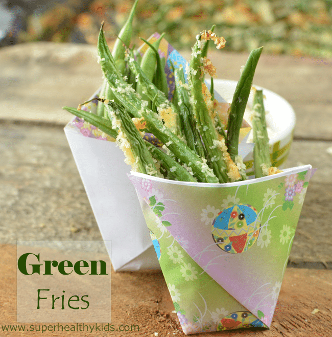 roasted green beans in a paper cup