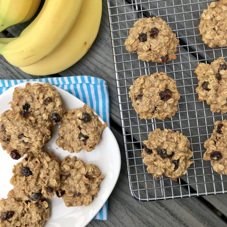 oat cookies cooling on a rack and plate