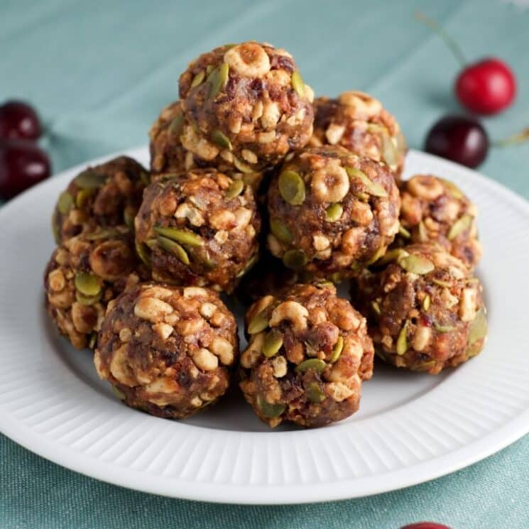 cheerio energy balls with pumpkin seeds on a plate