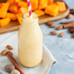 pumpkin shake with pumpkin chunks in the background