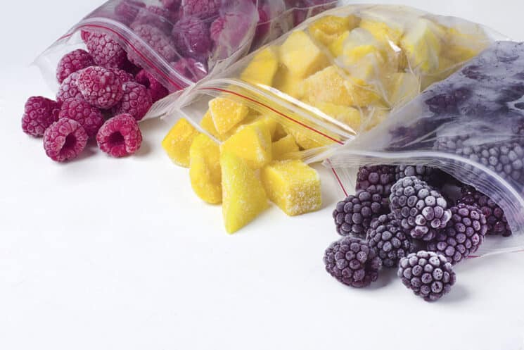 frozen raspberries, pineapple and blackberries in bags