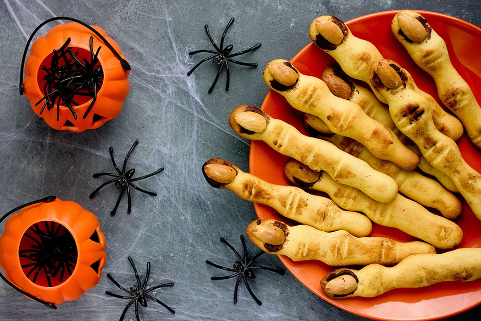 sugar cookies shaped into witch fingers with almond finger nails