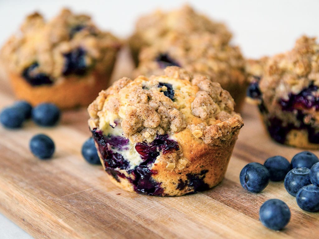 freshly baked blueberry oat muffins with an oat crumble topping