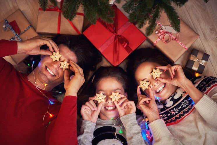 Family eating under the Christmas tree
