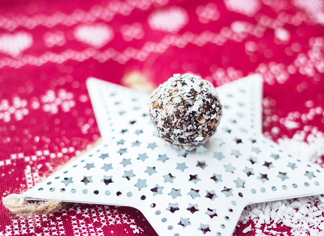 no bake coconut snowball sitting on a white christmas ornament star