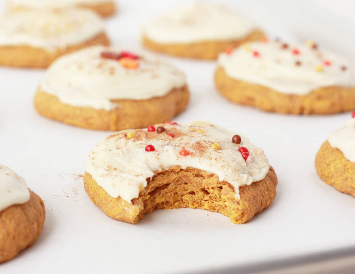 soft pumpkin cookies with maple frosting with fall sprinkles