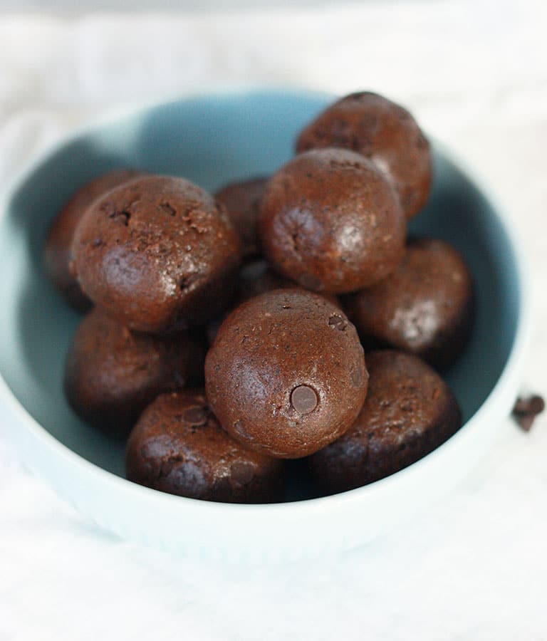 Brownie Batter Protein Bites in a blue bowl