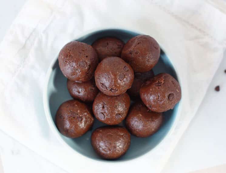 overhead view of a bowl full of brownie batter protein bites