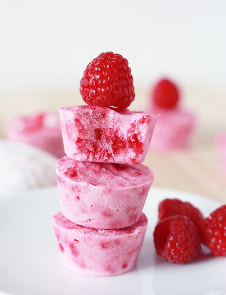 Raspberry Frozen Yogurt Bites topped with a fresh raspberries