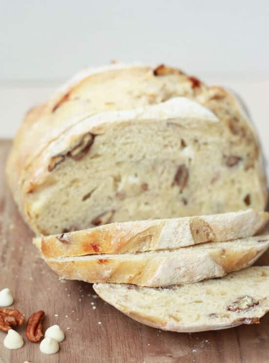 White Chocolate Pecan Sourdough Bread 4 white chocolate pecan sourdough bread sliced on a wood cutting board