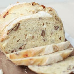 White Chocolate Pecan Sourdough Bread 5 white chocolate pecan sourdough bread sliced on a wooden cutting board
