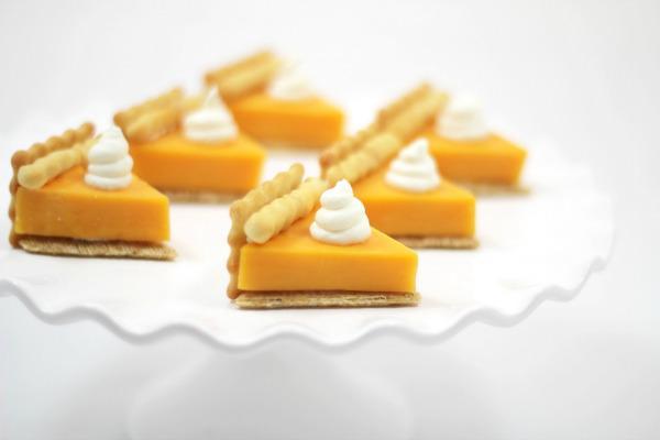 cheese cut into triangles to resemble pie with a cream cheese dab to look like whipped cream