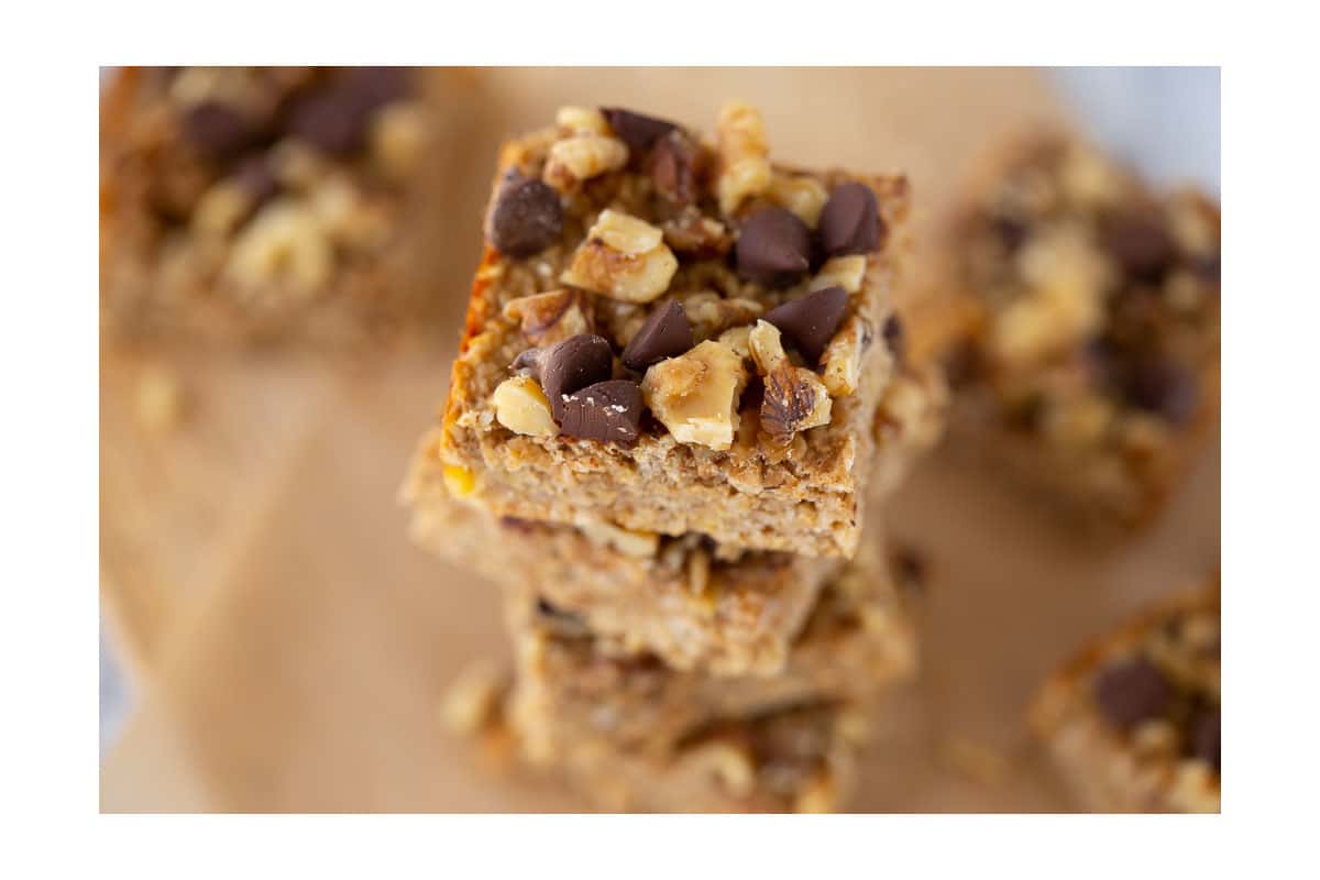 peanut butter banana bars stacked on parchment paper
