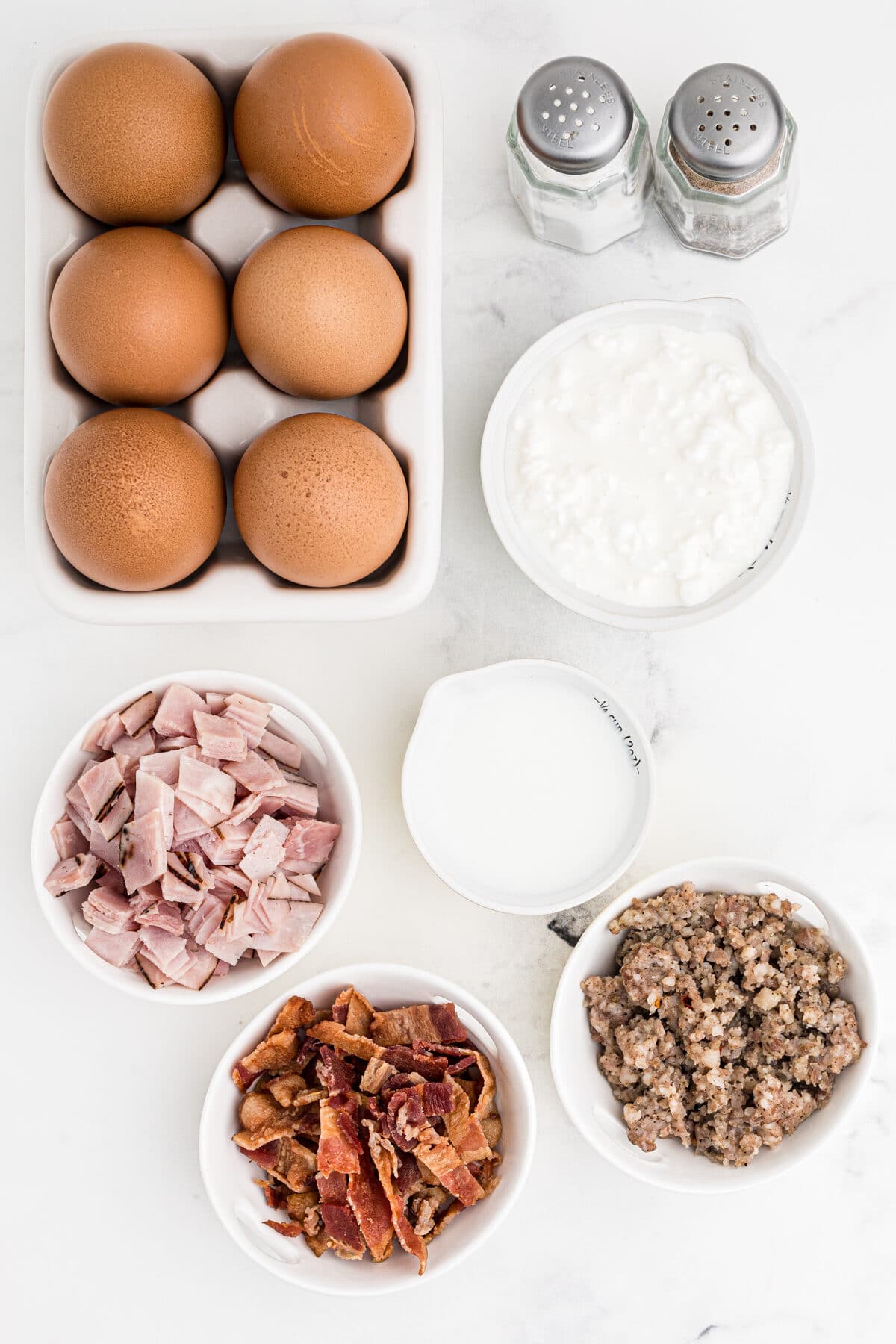 ingredients for meat lovers breakfast egg cups, diced ham, crumbled bacon, crumbled sausage