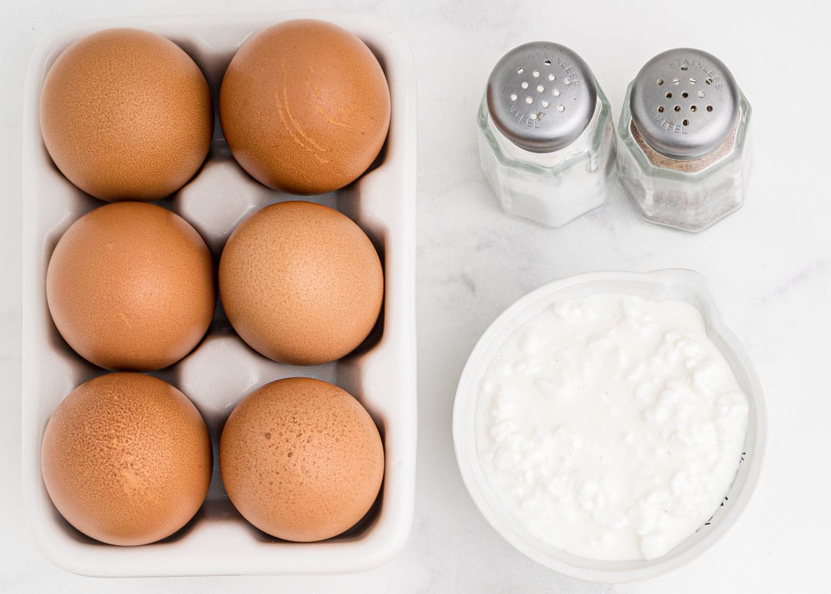 basic ingredients for breakfast egg cups, eggs, milk, cottage cheese, salt and pepper