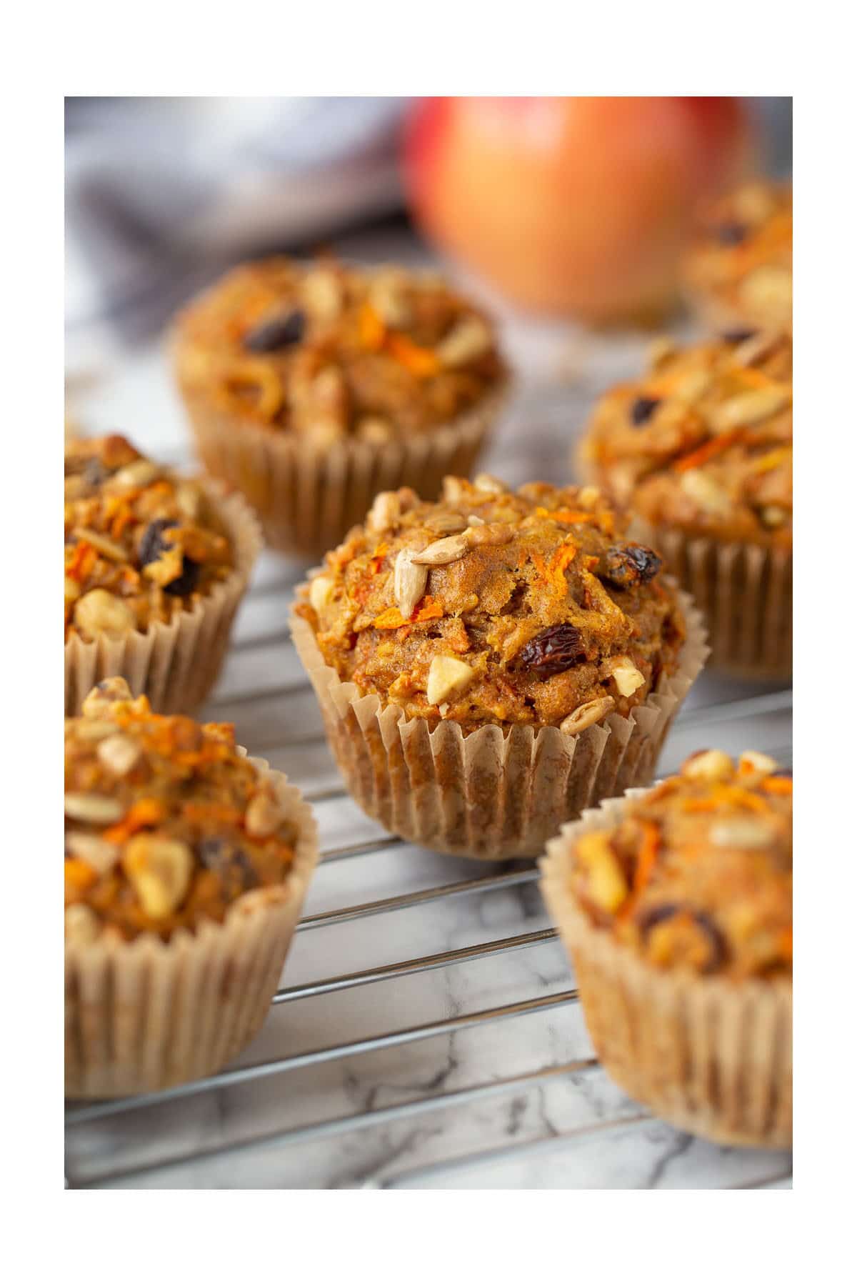 morning glory muffins in paper liners on a cooking rack