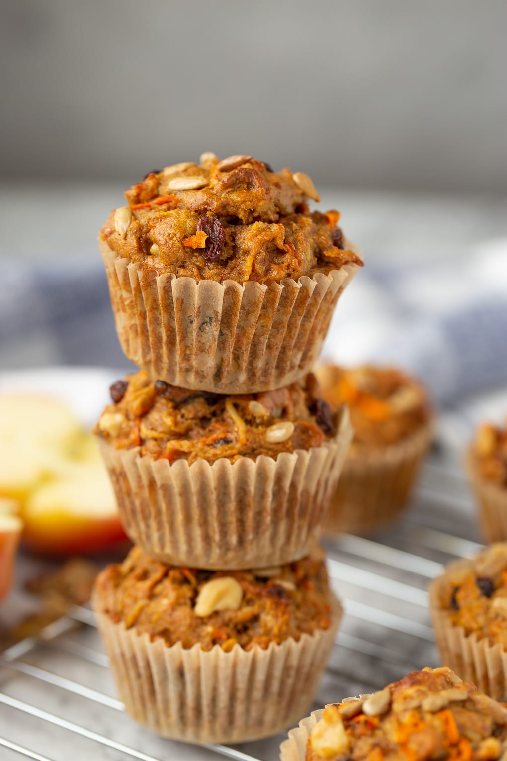 healthy morning glory muffins stacked on top of each other