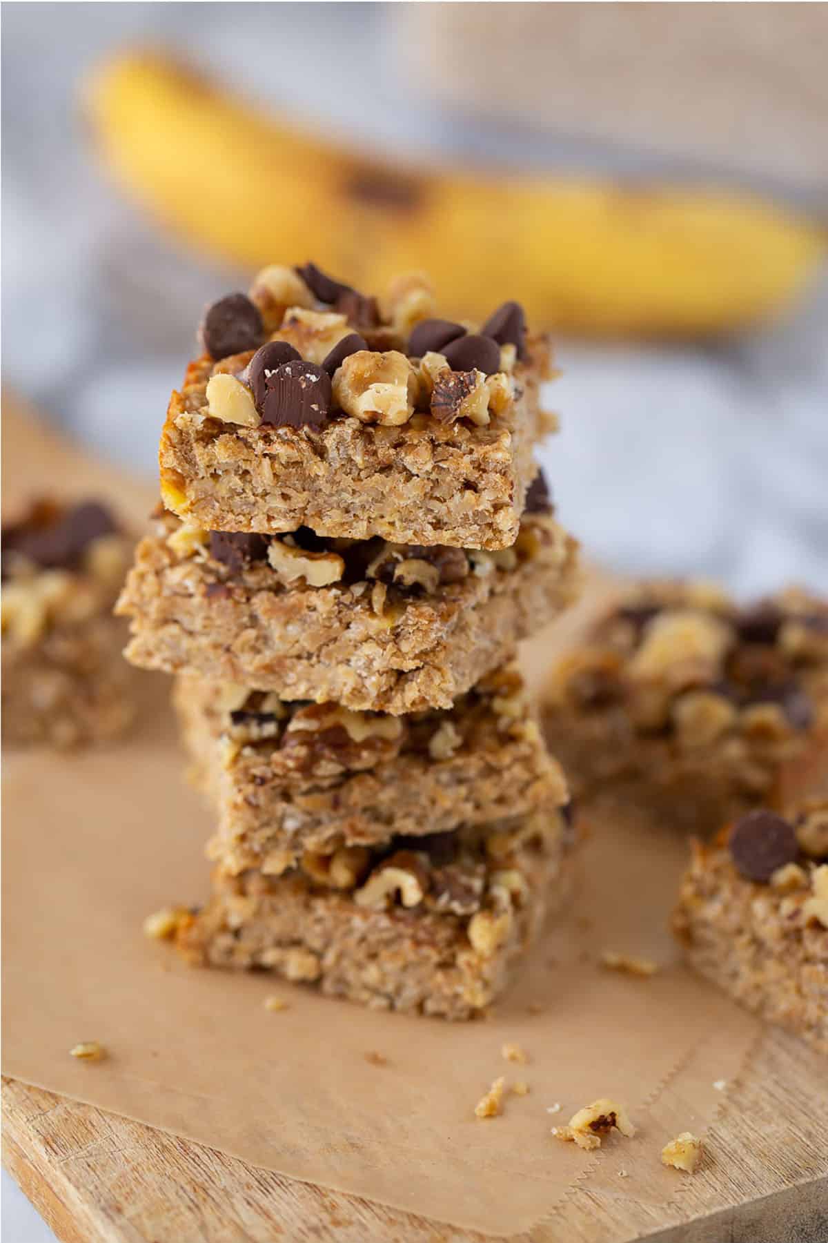 3 ingredient peanut butter banana snack bars cut into squares and stacked. 