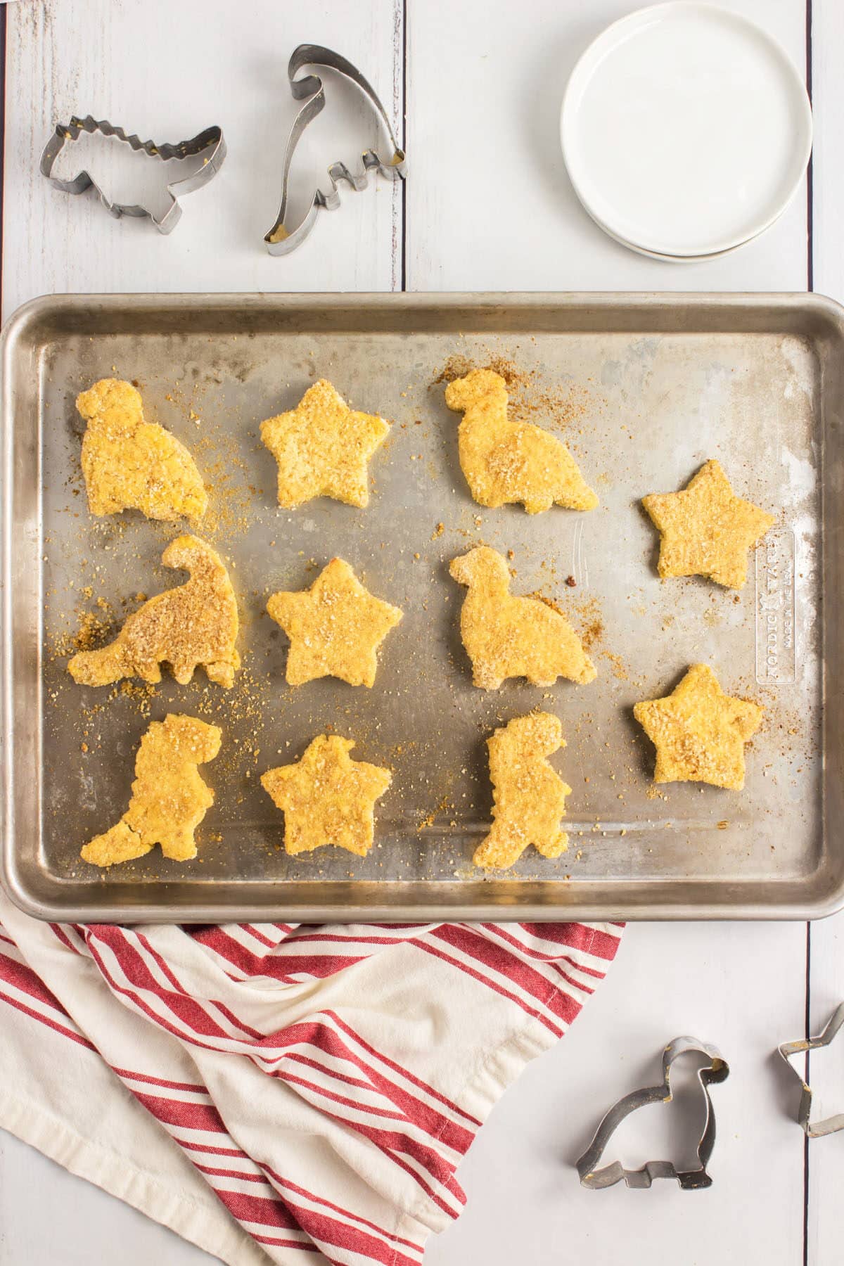 homemade chicken nuggets in shapes on a baking tray