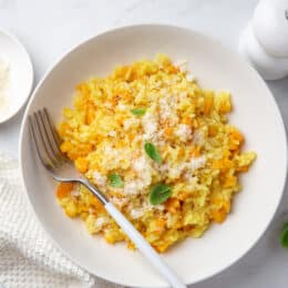 butternut squash risotto in a white bowl