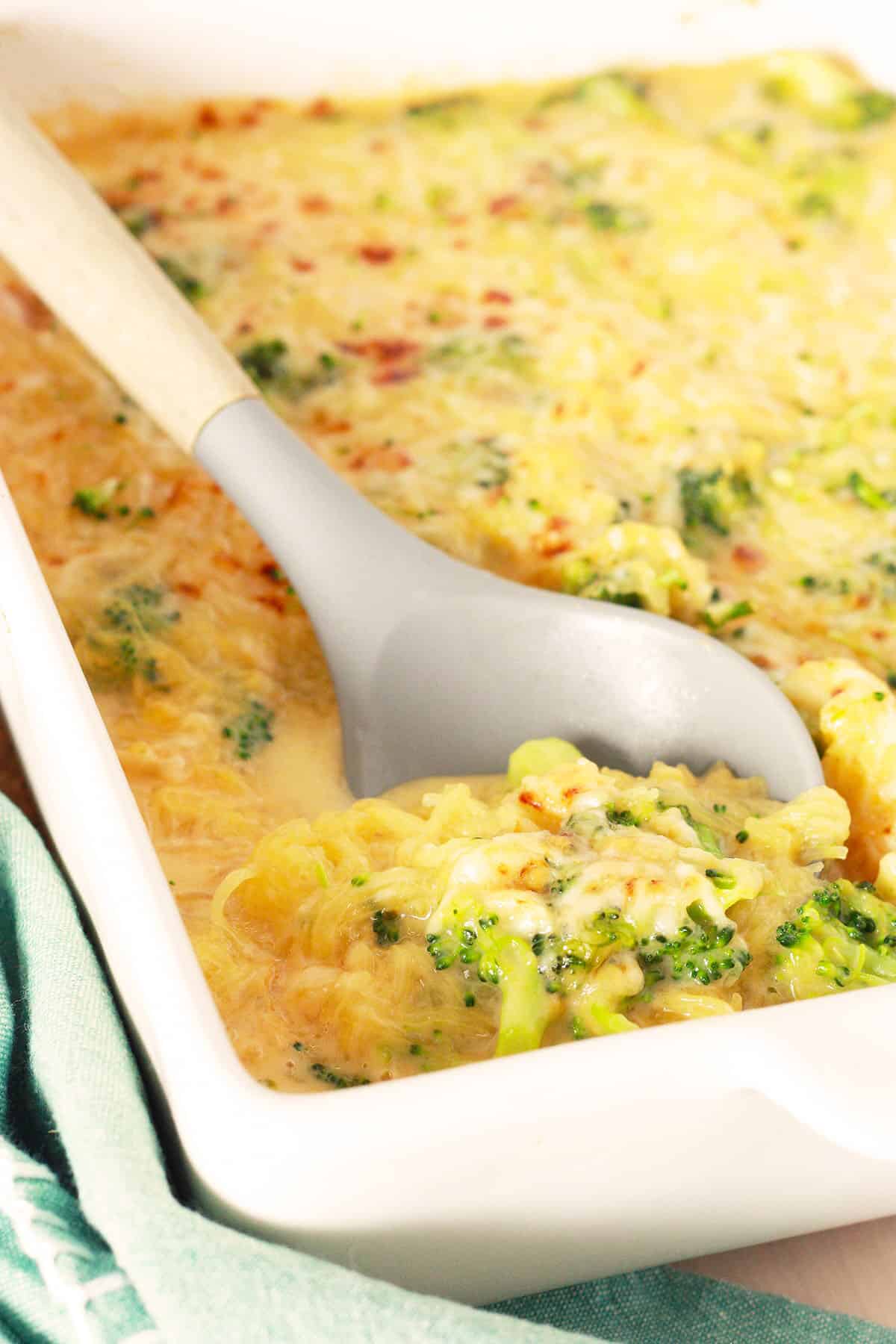 cheesy spaghetti squash casserole in a white serving dish