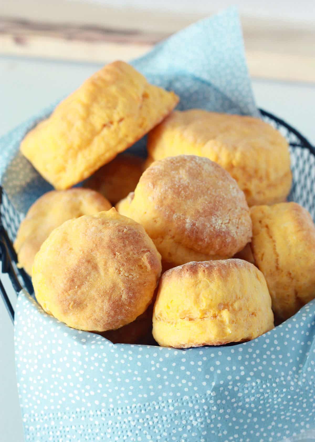 sweet potato biscuits in a bowl with blue napkins