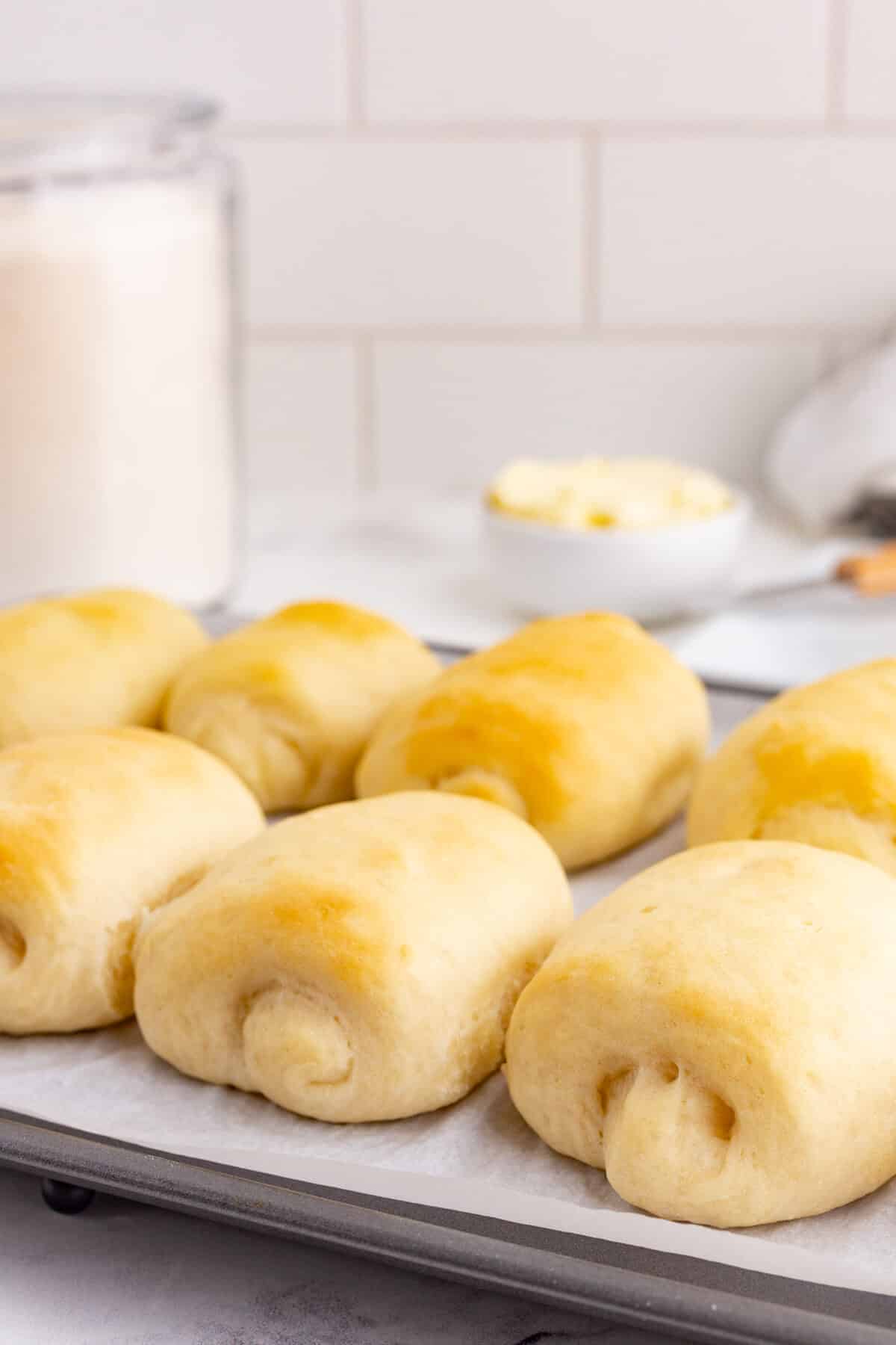 freshly baked rolls on a baking sheet