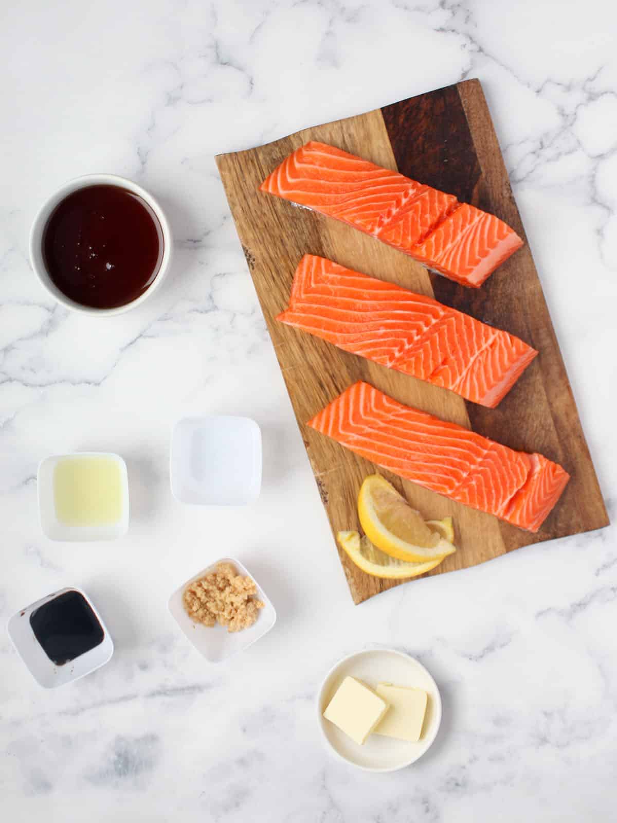 ingredients for honey garlic salmon: salmon fillets, soy sauce, butter, honey, garlic, lemon