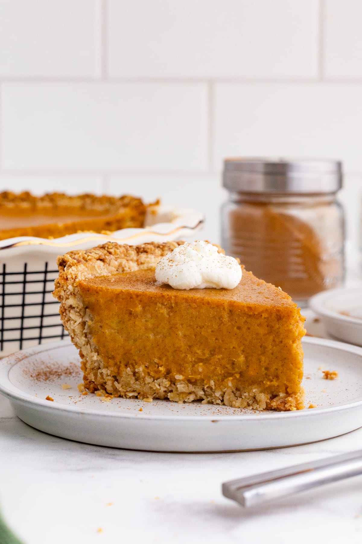 slice of sweet potato pie topped with whip cream