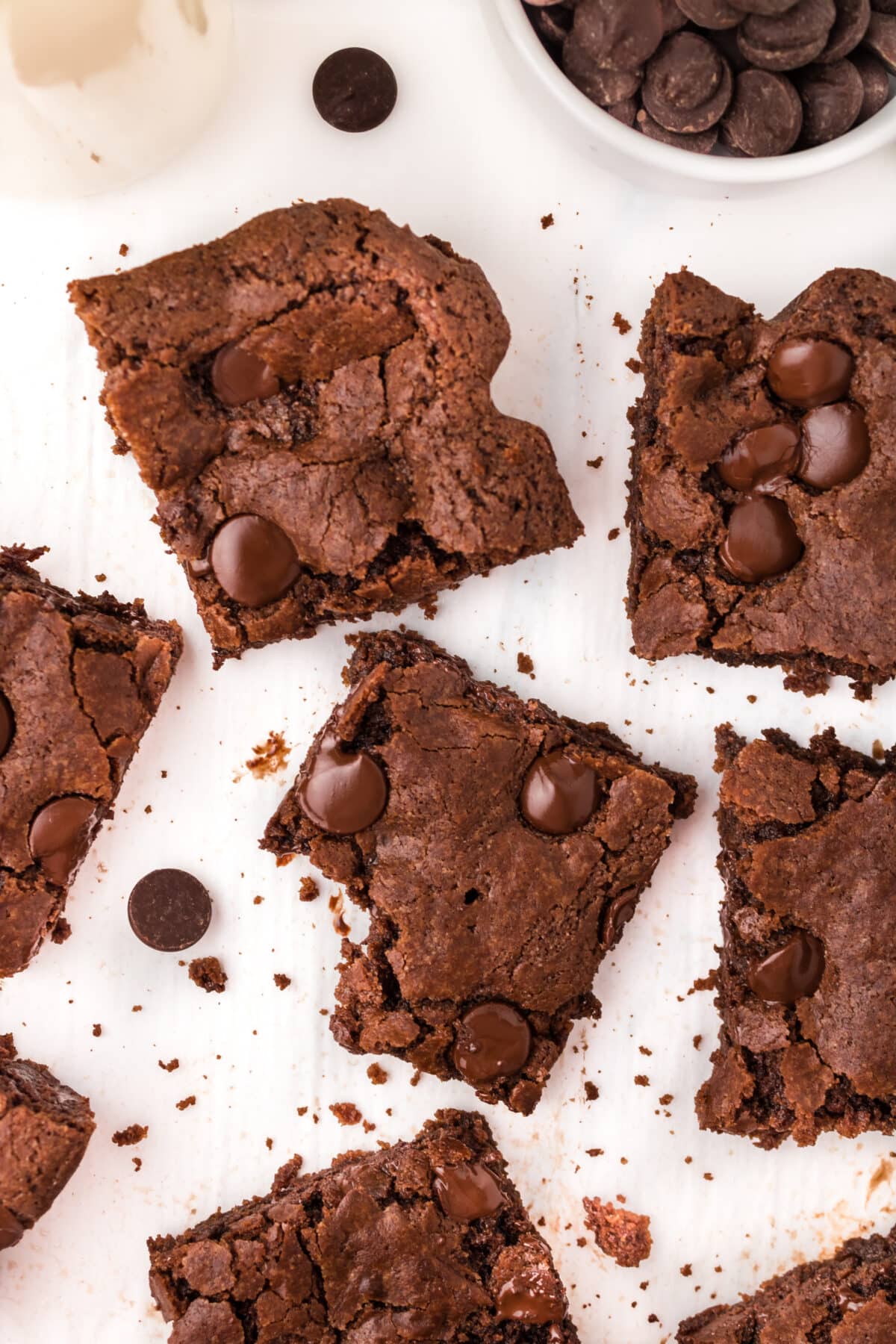 chocolate chip brownies on a sheet of parchment