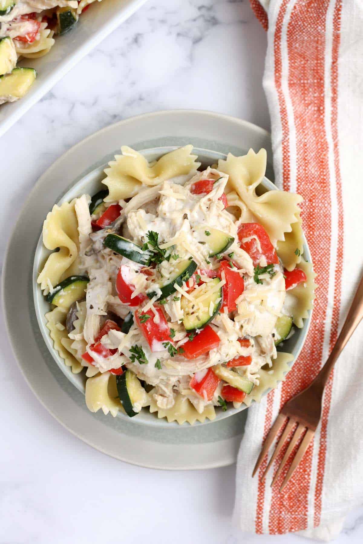 crockpot italian chicken served over bowtie pasta